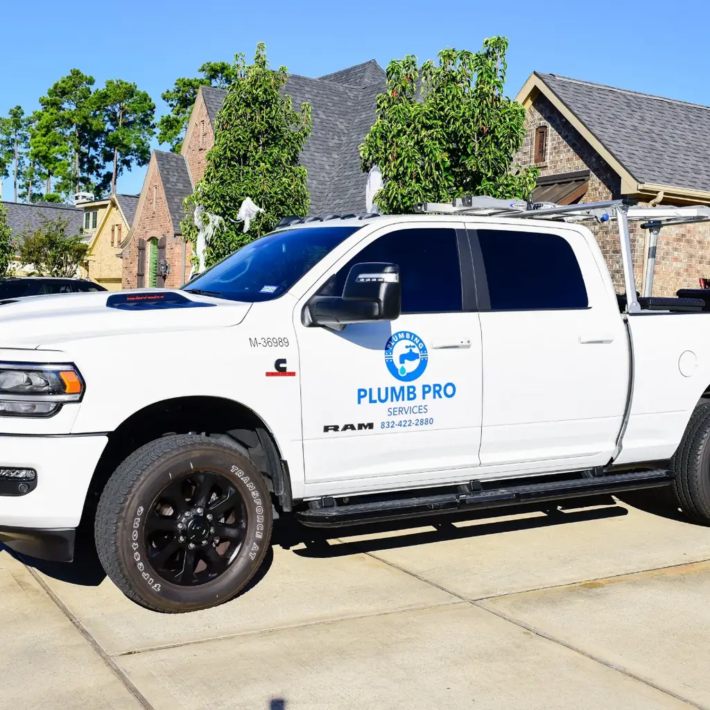 Plumb Pro Services branded pickup parked at a residential driveway in Spring, TX